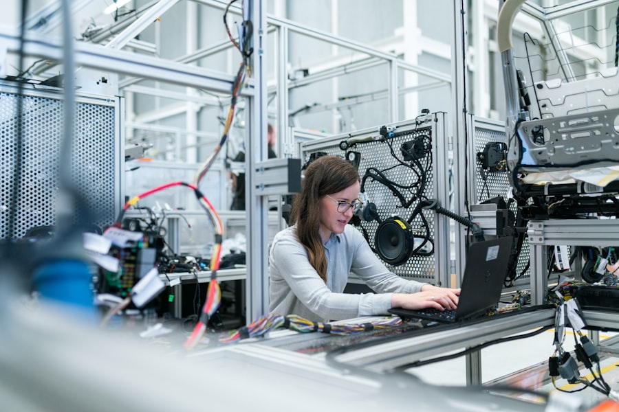 Engineer working on production line equipment in a factory